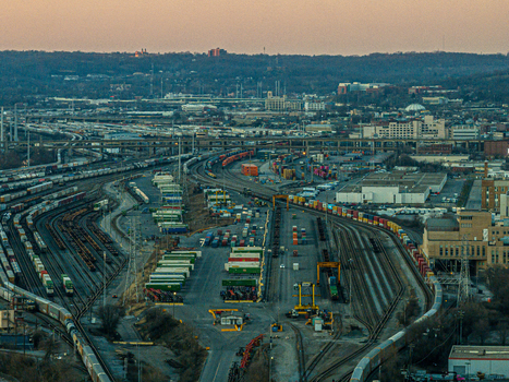 Cincinnati United States 27 February 2026 Aerial view of a sprawling railyard bathed in the warm glow of the setting sun with trains snaking through a landscape of industrial buildings. Cincinnati United States 27 February 2026 Aerial view of a sprawling railyard bathed in the warm glow of the setting sun with trains snaking through a landscape of industrial buildings.