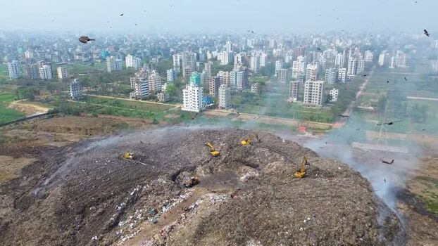 Aerial view of construction vehicles on a landfill Bangladesh. Aerial view of construction vehicles on a landfill Bangladesh.