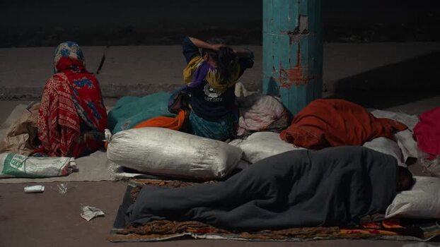 View of people sleeping on the street at night in Bogura Bangladesh. View of people sleeping on the street at night in Bogura Bangladesh.