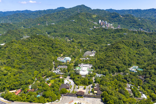 Aerial view of the lush green landscape of Taipei Zoo surrounded by dense forests and mountains in Taipei City Taiwan. Aerial view of the lush green landscape of Taipei Zoo surrounded by dense forests and mountains in Taipei City Taiwan.