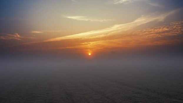 View of a golden sunrise over thick morning fog Bangladesh. View of a golden sunrise over thick morning fog Bangladesh.