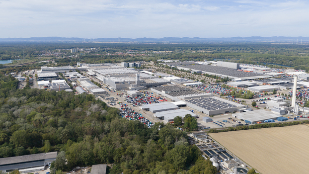 Worth am Rhein Rheinland Pfalz Germany 19 September 2026 Aerial view of the Mercedes Benz Werk Worth industrial complex with factory buildings parked trucks and green landscape.