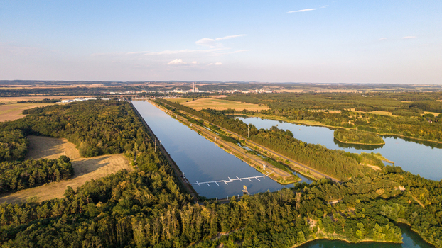 Aerial view of Labe Arena Racice a rowing canal surrounded by lush forests and agricultural fields in Racice Ustecky kraj Czechia. Aerial view of Labe Arena Racice a rowing canal surrounded by lush forests and agricultural fields in Racice Ustecky kraj Czechia.