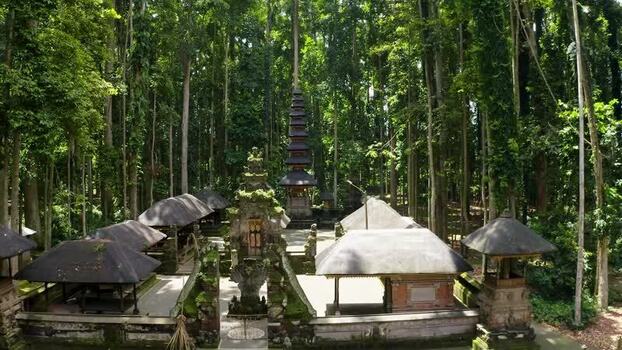 Aerial view of a traditional Hindu temple in a dense forest Indonesia.