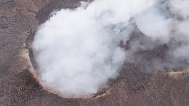 Aerial view of smoke rising from Erta Ale Volcano crater Ethiopia. Aerial view of smoke rising from Erta Ale Volcano crater Ethiopia.