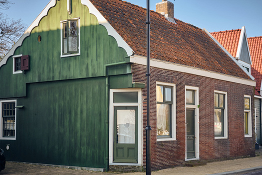 Wormerveer Netherlands 22 March 2026 View of renovated historic buildings along Noordeinde featuring traditional green wooden facades and brick architecture. Wormerveer Netherlands 22 March 2026 View of renovated historic buildings along Noordeinde featuring traditional green wooden facades and brick architecture.