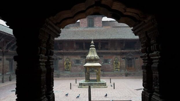 View of a historic courtyard and shrine in Kathmandu Nepal.