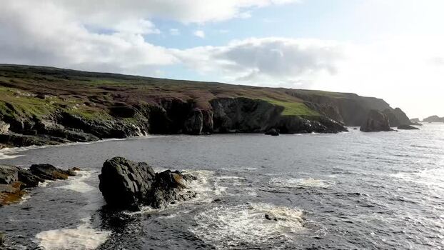 Aerial view of rugged cliffs and rocky coastline Ireland.