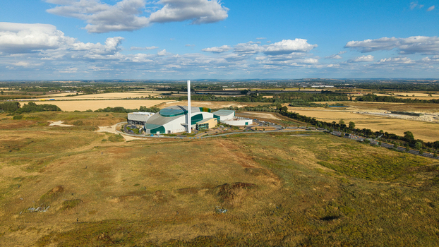 Aerial view of the Energy Recovery Facility a modern biomass to electricity plant surrounded by rural fields and farmland in Bicester England United Kingdom.