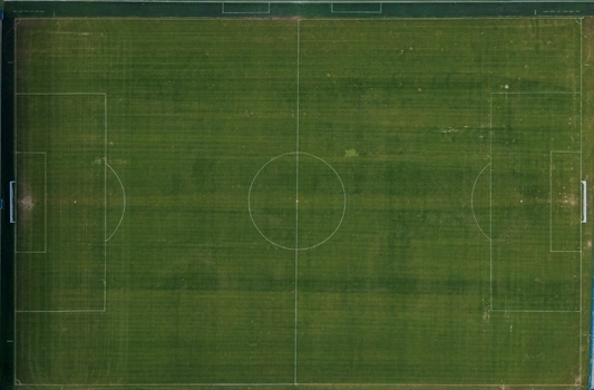 Aerial view of a soccer field with green grass and white markings in Istanbul Istanbul Turkiye. Aerial view of a soccer field with green grass and white markings in Istanbul Istanbul Turkiye.