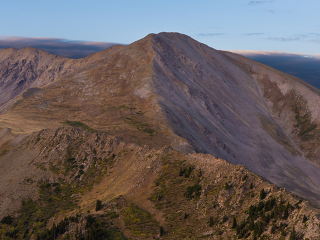 Aerial view of Missouri Mountain and the surrounding rugged Sawatch Range terrain featuring rocky slopes alpine vegetation and the Missouri Gulch Trail in Buena Vista Colorado United States.