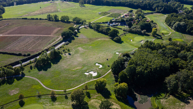 Aerial view of Hamptworth Golf course featuring lush green fairways sand bunkers and surrounding woodland in Hamptworth England United Kingdom. Aerial view of Hamptworth Golf course featuring lush green fairways sand bunkers and surrounding woodland in Hamptworth England United Kingdom.