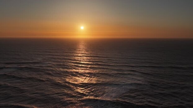 Aerial view of ocean waves at dusk Portugal.