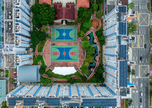 Aerial view of Boon Keng residential area featuring HDB apartment blocks with rooftop solar panels colorful basketball courts and surrounding urban infrastructure in Singapore Bendemeer Road Singapore. Aerial view of Boon Keng residential area featuring HDB apartment blocks with rooftop solar panels colorful basketball courts and surrounding urban infrastructure in Singapore Bendemeer Road Singapore.