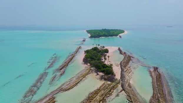 Aerial view of island with turquoise water Maldives.