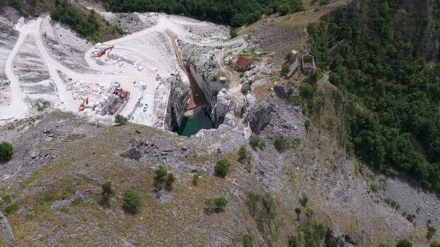Aerial view of Carrara marble quarry excavation site Italy. Aerial view of Carrara marble quarry excavation site Italy.