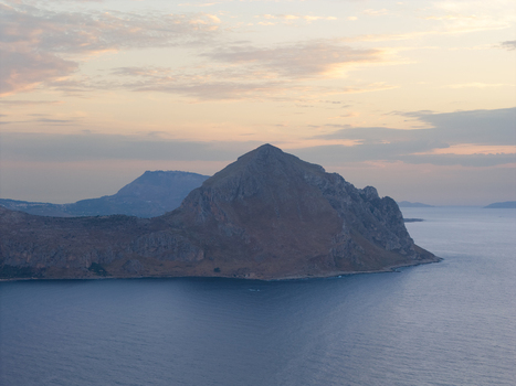 Aerial view of the rugged coastline and cliffs of Riserva Naturale Orientata dello Zingaro at sunset surrounded by the Mediterranean sea in San Vito Lo Capo Sicilia Italy. Aerial view of the rugged coastline and cliffs of Riserva Naturale Orientata dello Zingaro at sunset surrounded by the Mediterranean sea in San Vito Lo Capo Sicilia Italy.