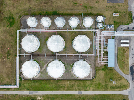 Aerial view of industrial storage tanks connected by a network of pipelines in a fenced facility in Olaine parish Olaine Municipality Latvia.