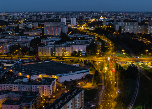 Aerial view of Jana III Sobieskiego Bus and Tram Terminal at night with illuminated roads residential buildings and city lights in Poznan Greater Poland Voivod Poland. Aerial view of Jana III Sobieskiego Bus and Tram Terminal at night with illuminated roads residential buildings and city lights in Poznan Greater Poland Voivod Poland.