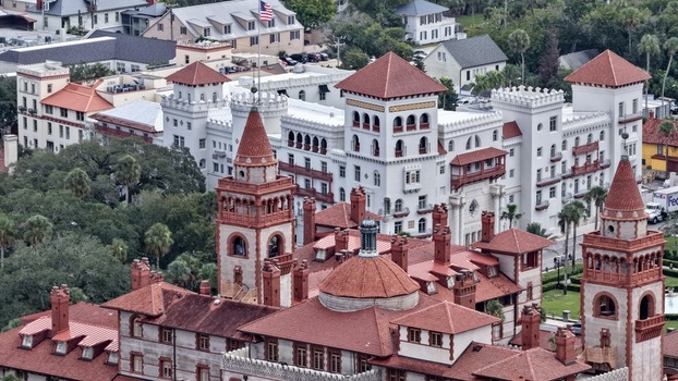 Aerial view of the historic Lightner Museum featuring ornate towers and red tiled roofs in St. Augustine Florida United States. Aerial view of the historic Lightner Museum featuring ornate towers and red tiled roofs in St. Augustine Florida United States.