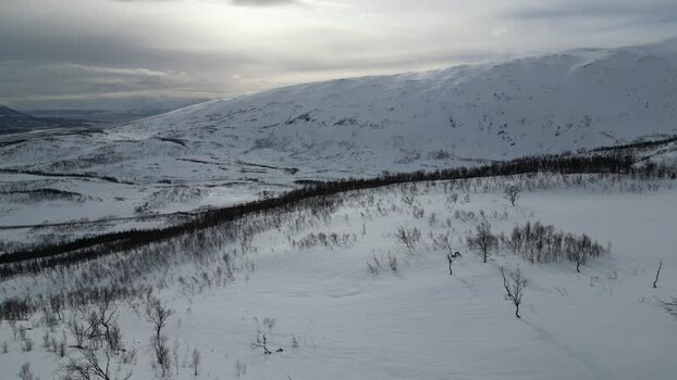 Aerial view of snow covered mountains on Kvaloya Norway.