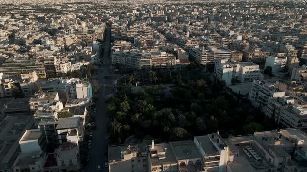 Aerial view of an urban park and city buildings in Athens Greece.