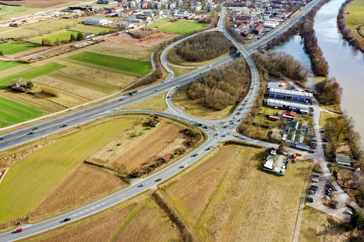 Aerial view of the highway interchange and surrounding green fields near the Regnitz river in Buttenheim Bavaria Germany. Aerial view of the highway interchange and surrounding green fields near the Regnitz river in Buttenheim Bavaria Germany.