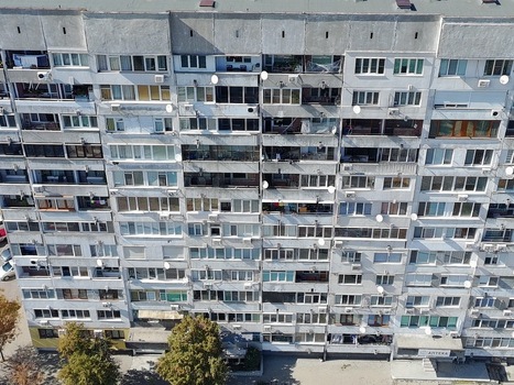 Aerial view of a large multi story residential apartment block with numerous balconies and satellite dishes in Sofia Sofia City Province Bulgaria. Aerial view of a large multi story residential apartment block with numerous balconies and satellite dishes in Sofia Sofia City Province Bulgaria.