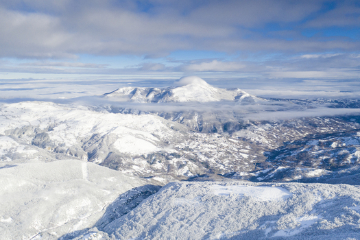 Aerial view of the snow covered mountain peaks and winter landscape of the Apennine Mountains Cerreto Laghi Emilia Romagna Italy. Aerial view of the snow covered mountain peaks and winter landscape of the Apennine Mountains Cerreto Laghi Emilia Romagna Italy.