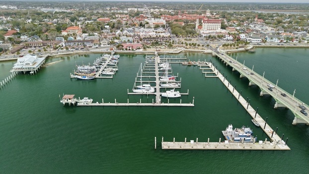 Aerial view of the Municipal Marina and Bridge of Lions with historic architecture and boats on the water in St. Augustine Florida United States.
