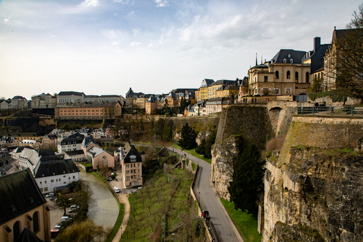 Aerial view of the historic Grund district featuring ancient stone fortifications a winding river and traditional buildings nestled in the valley Luxembourg Luxembourg Luxembourg.