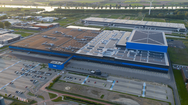 Waalwijk Netherlands 09 May 2026 Aerial view of the Bol.com distribution center with its massive blue and grey warehouses solar panels on the roof and a large parking lot. Waalwijk Netherlands 09 May 2026 Aerial view of the Bol.com distribution center with its massive blue and grey warehouses solar panels on the roof and a large parking lot.