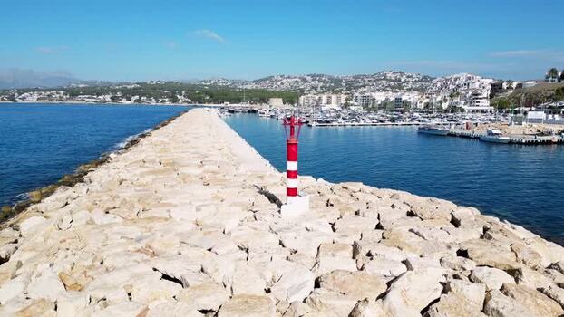 Aerial view of Moraira marina breakwater in Spain.