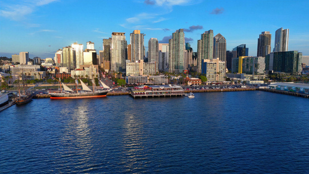 San Diego United States 01 April 2026 Aerial view of the San Diego skyline along North Harbor Drive and the North Embarcadero featuring a tall ship at the waterfront and modern skyscrapers.