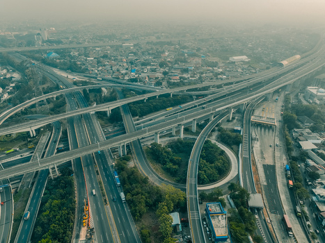 Aerial view of the Cikunir interchange a complex multi level highway junction with elevated roads and surrounding urban development in Kecamatan Bekasi Selatan Jawa Barat Indonesia. Aerial view of the Cikunir interchange a complex multi level highway junction with elevated roads and surrounding urban development in Kecamatan Bekasi Selatan Jawa Barat Indonesia.