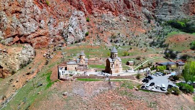 Aerial view of Noravank monastery complex and red rock cliffs Armenia.