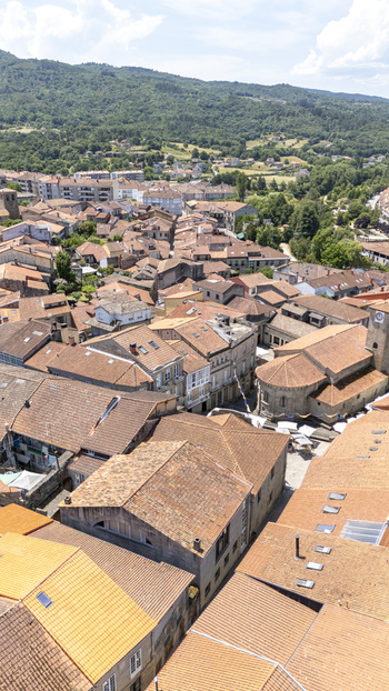 Aerial view of the historic town with its characteristic terracotta rooftops narrow streets and stone buildings nestled in the green landscape of Allariz Province of Ourense Spain. Aerial view of the historic town with its characteristic terracotta rooftops narrow streets and stone buildings nestled in the green landscape of Allariz Province of Ourense Spain.