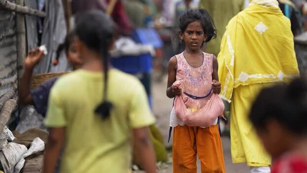 View of a young girl in a crowded street in Bogura Bangladesh. View of a young girl in a crowded street in Bogura Bangladesh.