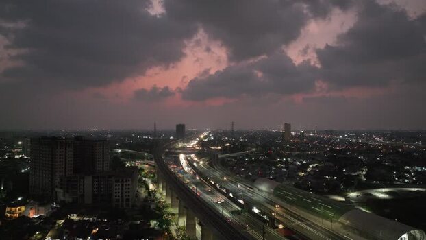Aerial view of highway interchange at dusk in Indonesia. Aerial view of highway interchange at dusk in Indonesia.