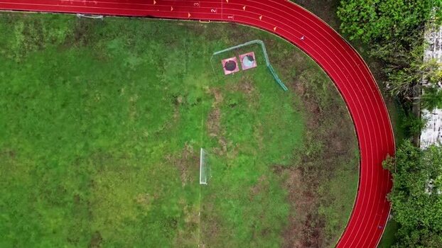 Aerial view of a red running track and green sports field Mexico. Aerial view of a red running track and green sports field Mexico.