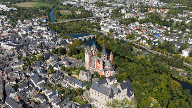 Aerial view of Limburg Cathedral situated on a rocky outcrop above the Lahn River surrounded by the historic old town with timber framed houses in Limburg an der Lahn Hessen Germany. Aerial view of Limburg Cathedral situated on a rocky outcrop above the Lahn River surrounded by the historic old town with timber framed houses in Limburg an der Lahn Hessen Germany.