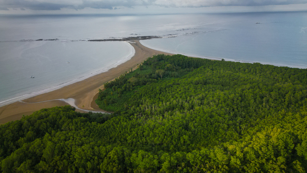 Aerial view of the Whale Tail at Marino Ballena National Park where the ocean meets the sandy shore Uvita Puntarenas Province Costa Rica. Aerial view of the Whale Tail at Marino Ballena National Park where the ocean meets the sandy shore Uvita Puntarenas Province Costa Rica.