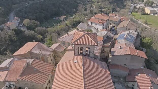 Aerial view of historic stone village rooftops in Terni Italy.