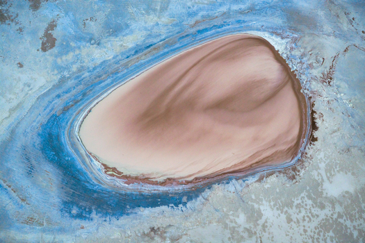 Aerial view of contrasting textures and tones paint a surreal landscape like an abstract artwork from above Salt Lake City Utah United States. Aerial view of contrasting textures and tones paint a surreal landscape like an abstract artwork from above Salt Lake City Utah United States.