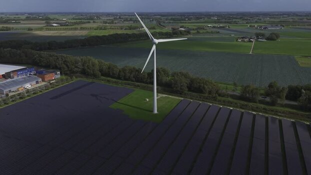 Aerial view of wind turbine and solar farm in t Zand Netherlands.