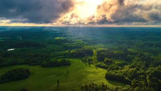 Aerial view of lush green forests and meadows in Latvia. Aerial view of lush green forests and meadows in Latvia.