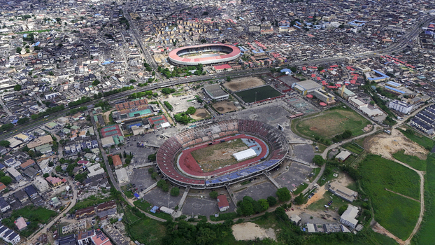Aerial view of the National Stadium Surulere Lagos and the surrounding dense urban landscape with residential buildings and roads Lagos Lagos Nigeria.