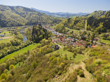 Aerial view of Orava Castle perched on a high rock above the Orava river surrounded by lush green hills and a small village near Dolny Kubin Zilinsky kraj Slovakia. Aerial view of Orava Castle perched on a high rock above the Orava river surrounded by lush green hills and a small village near Dolny Kubin Zilinsky kraj Slovakia.