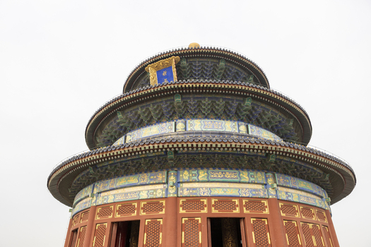 View of the Hall of Prayer for Good Harvests at the Temple of Heaven with its iconic triple eaved circular roof and ornate colorful details in Beijing Beijing China. View of the Hall of Prayer for Good Harvests at the Temple of Heaven with its iconic triple eaved circular roof and ornate colorful details in Beijing Beijing China.