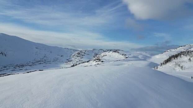 Aerial view of the snowy mountains of Kvaloya Norway.